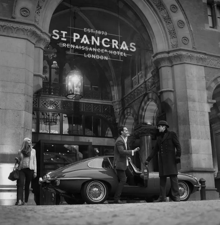 A couple exiting a car in front of St. Pancras in London